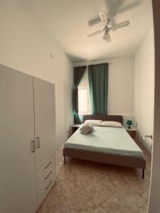 Posteľ alebo postele v izbe v ubytovaní Casa Vacanze , Scoglitti