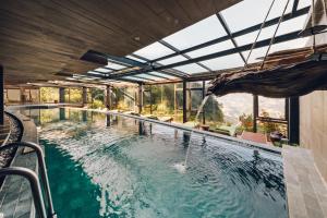 a swimming pool with a view of a mountain at Sapa Jade Hill Resort & Spa in Sapa