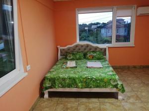 a small bed in a room with a window at Black Sea STAR in Chornomorsk