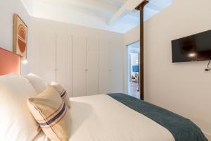 Postel nebo postele na pokoji v ubytování Puerta Real Home Apartment 2
