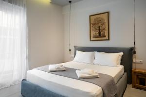 Postel nebo postele na pokoji v ubytování Crown Designed Apartments