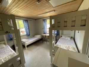 Postel nebo postele na pokoji v ubytování Aspan Kurs & Lägergård