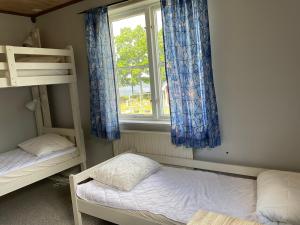 Voodi või voodid majutusasutuse Aspan Kurs & Lägergård toas