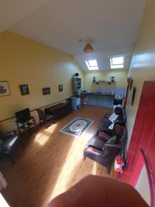 an overhead view of a living room with a couch and chairs at Slane Farm Hostel, Cottages and Camping in Slane