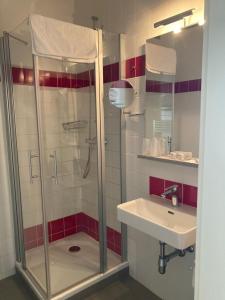 a bathroom with a shower and a sink at Kolpingsfamilie Poysdorf in Poysdorf