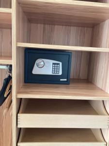 a cabinet with a remote control sitting on a shelf at Kolpingsfamilie Poysdorf in Poysdorf