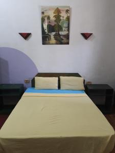 Postel nebo postele na pokoji v ubytování African House Hostel