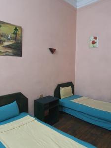 Postel nebo postele na pokoji v ubytování African House Hostel
