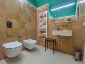 a bathroom with a toilet and a sink at Speciale Tarshito Guesthouse Bari in Bari +38 photos