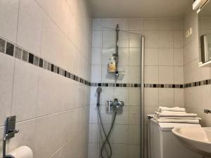 a bathroom with a shower and a toilet and a sink at Scandinavian apartments Heart of the city Kamppi 1, 5, 6 in Helsinki +36 photos