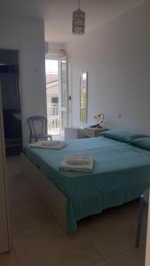 A bed or beds in a room at Affittacamere delle rose