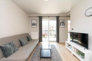 Televízia a/alebo spoločenská miestnosť v ubytovaní Main Trainstation one bedroom AC p4you pl
