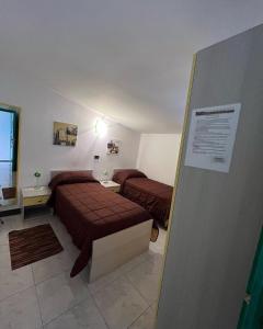 Llit o llits en una habitació de B&B Le Terrazze