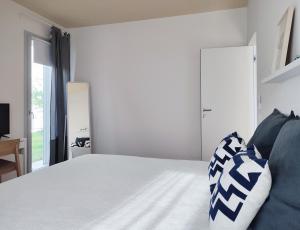 A bed or beds in a room at Dimore della Fausa