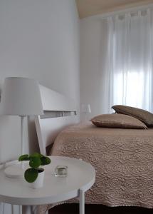 A bed or beds in a room at Dimore della Fausa