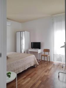 A bed or beds in a room at Dimore della Fausa