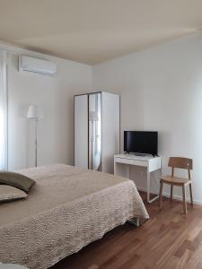 A bed or beds in a room at Dimore della Fausa
