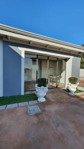 a building with two toilets in front of it at La Rosa Dei Venti in Manerbio