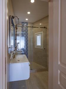 a bathroom with a sink and a shower at Ragip Pasha Apartments in Istanbul