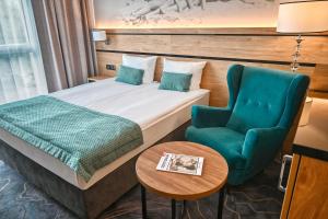 Łóżko lub łóżka w pokoju w obiekcie Sopotorium Hotel & Medical Spa
