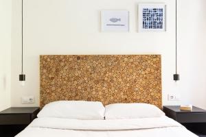 Posteľ alebo postele v izbe v ubytovaní WOW Apartments by Olala Homes