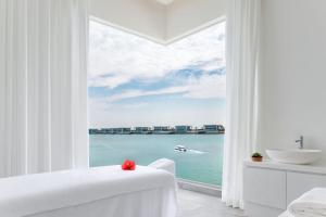 a view from a window of a large body of water at Nurai Island Resort in Abu Dhabi