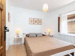 Posteľ alebo postele v izbe v ubytovaní Preciosa casa rural en el centro de Peratallada