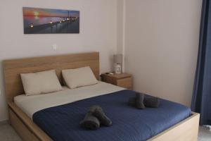 Ένα ή περισσότερα κρεβάτια σε δωμάτιο στο Irida's apartment in Porto Cheli
