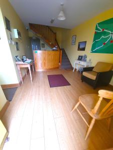 a living room with a couch and a table at Slane Farm Hostel, Cottages and Camping in Slane