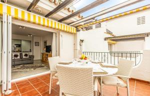a dining room with a table and chairs on a balcony at Mirador de Calahonda 80 in Mijas