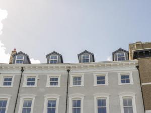 a row of windows on a building at Foxton Penthouse in Whitby