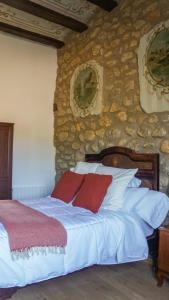 Un pat sau paturi într-o cameră la Casa Rural Hípica Molí categoria superior