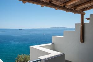 a view of the ocean from the balcony of a house at Aelia Mare Apartments Nr4 in Istérnia
