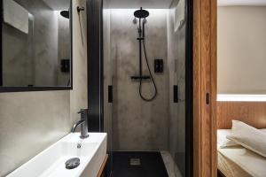 a bathroom with a shower and a sink at Ella Hostel Ramblas in Barcelona
