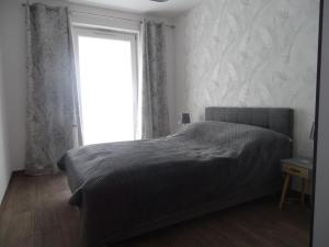 Postel nebo postele na pokoji v ubytování Apartament Król Neptun
