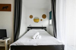 Posteľ alebo postele v izbe v ubytovaní Studio Arena / Plage à 2min / Parking privé / Terrasse