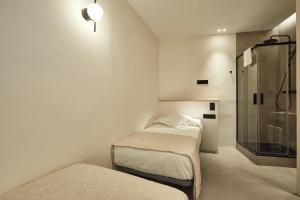 Ein Bett oder Betten in einem Zimmer der Unterkunft Ella Hostel Ramblas
