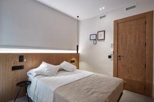 Ein Bett oder Betten in einem Zimmer der Unterkunft Ella Hostel Ramblas