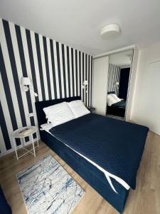 Łóżko lub łóżka w pokoju w obiekcie Villa Neptun - apartament przyjazny zwierzętom