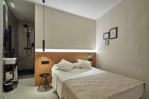 Ein Bett oder Betten in einem Zimmer der Unterkunft Ella Hostel Ramblas