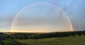 twobows in the sky over a green field at Widokówka Kaszuby in Mirachowo +81 photos
