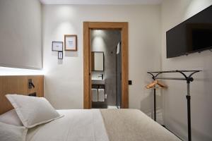 Ein Bett oder Betten in einem Zimmer der Unterkunft Ella Hostel Ramblas