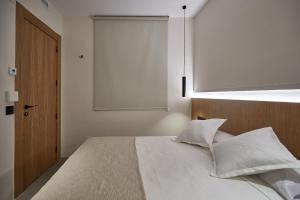 Ein Bett oder Betten in einem Zimmer der Unterkunft Ella Hostel Ramblas