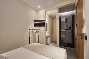 Ein Bett oder Betten in einem Zimmer der Unterkunft Ella Hostel Ramblas