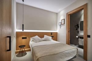 Ein Bett oder Betten in einem Zimmer der Unterkunft Ella Hostel Ramblas