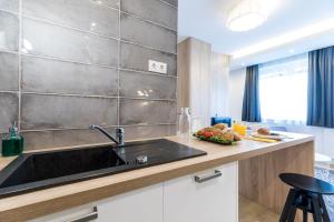 a kitchen with a sink and a counter at Vagabond Corvin in Budapest +167 photos