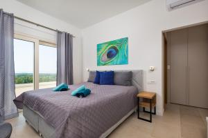 Posteľ alebo postele v izbe v ubytovaní Villa Carimelli