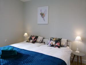 Posteľ alebo postele v izbe v ubytovaní Apartament BB z widokiem na Krynicę