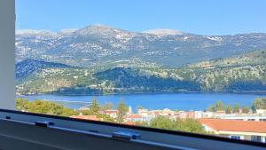 a view of a large body of water with mountains at Blue Lagoon Luxury Apartment A2 in Argostoli