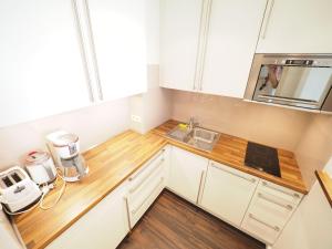 Kuchyň nebo kuchyňský kout v ubytování Appartement-173 + 6 fotografií